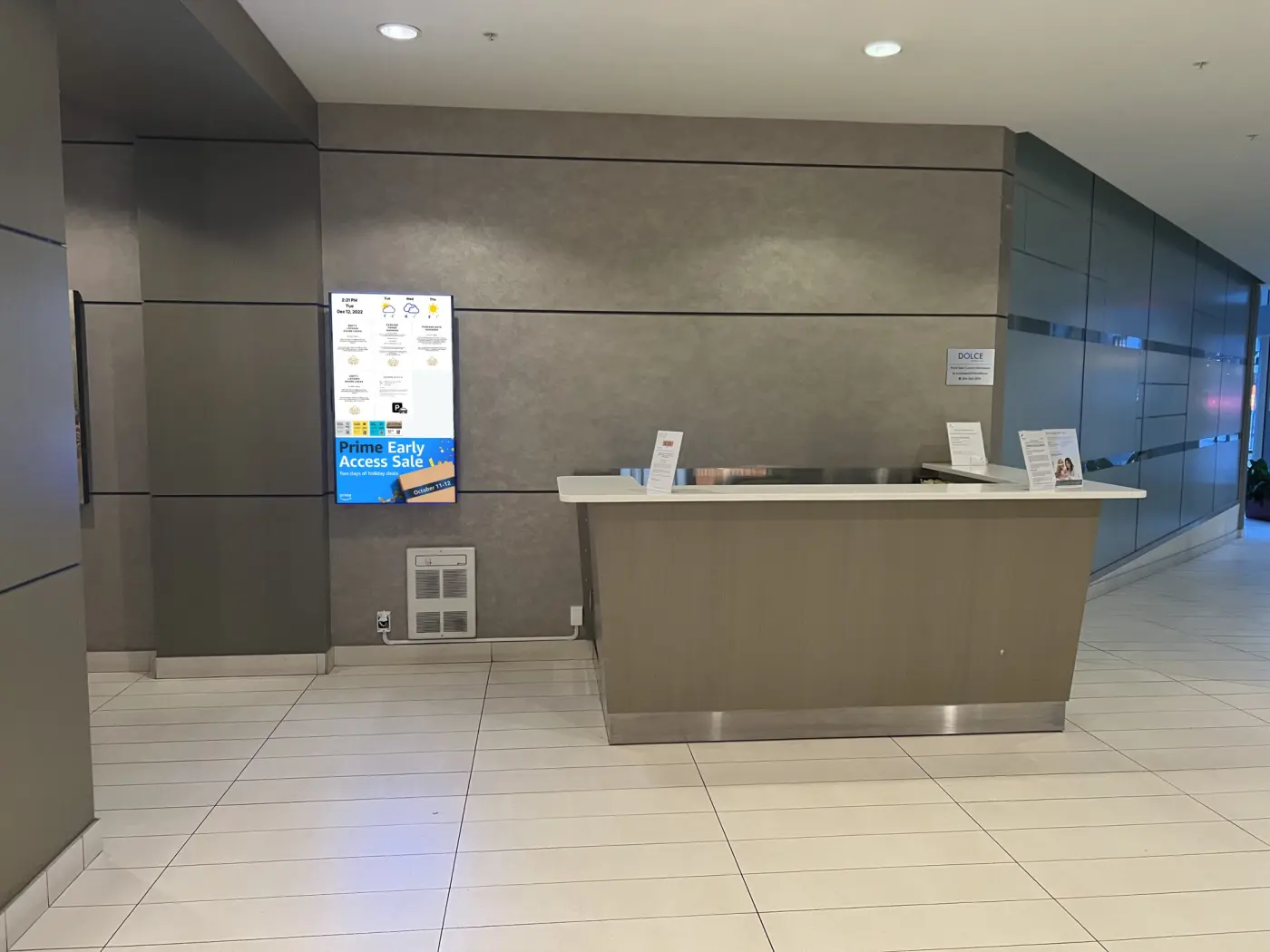 Emplace screen at a building concierge desk