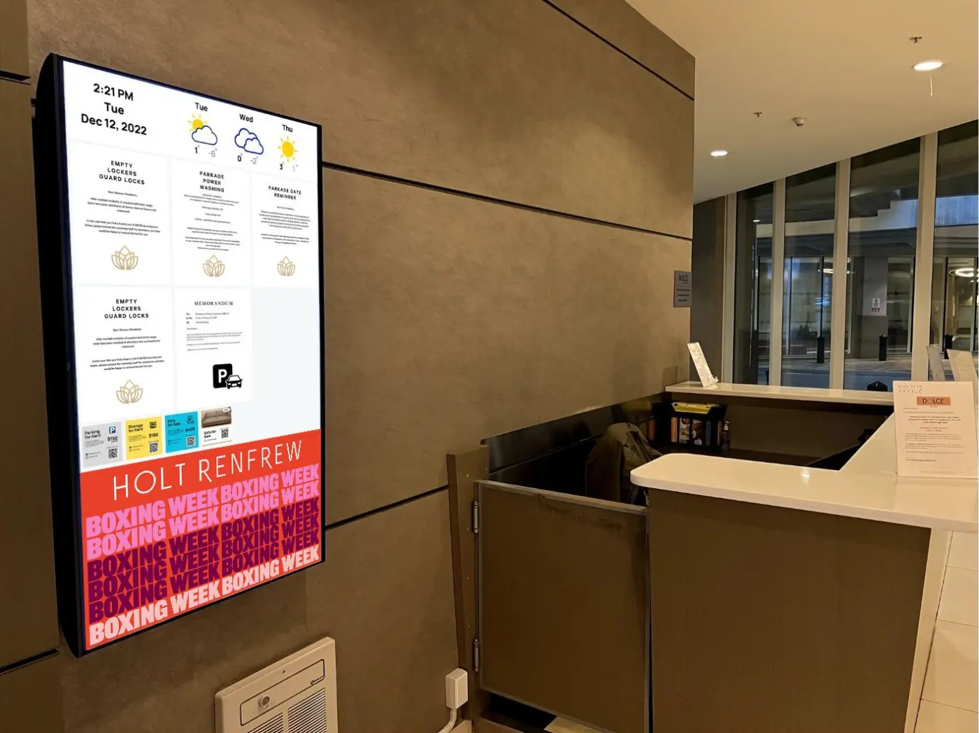 Portrait Emplace screen at a building concierge desk