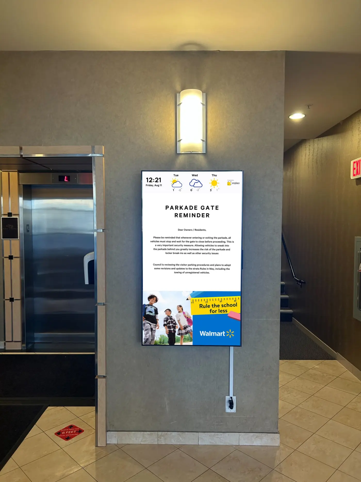 Emplace screen at a building elevator lobby